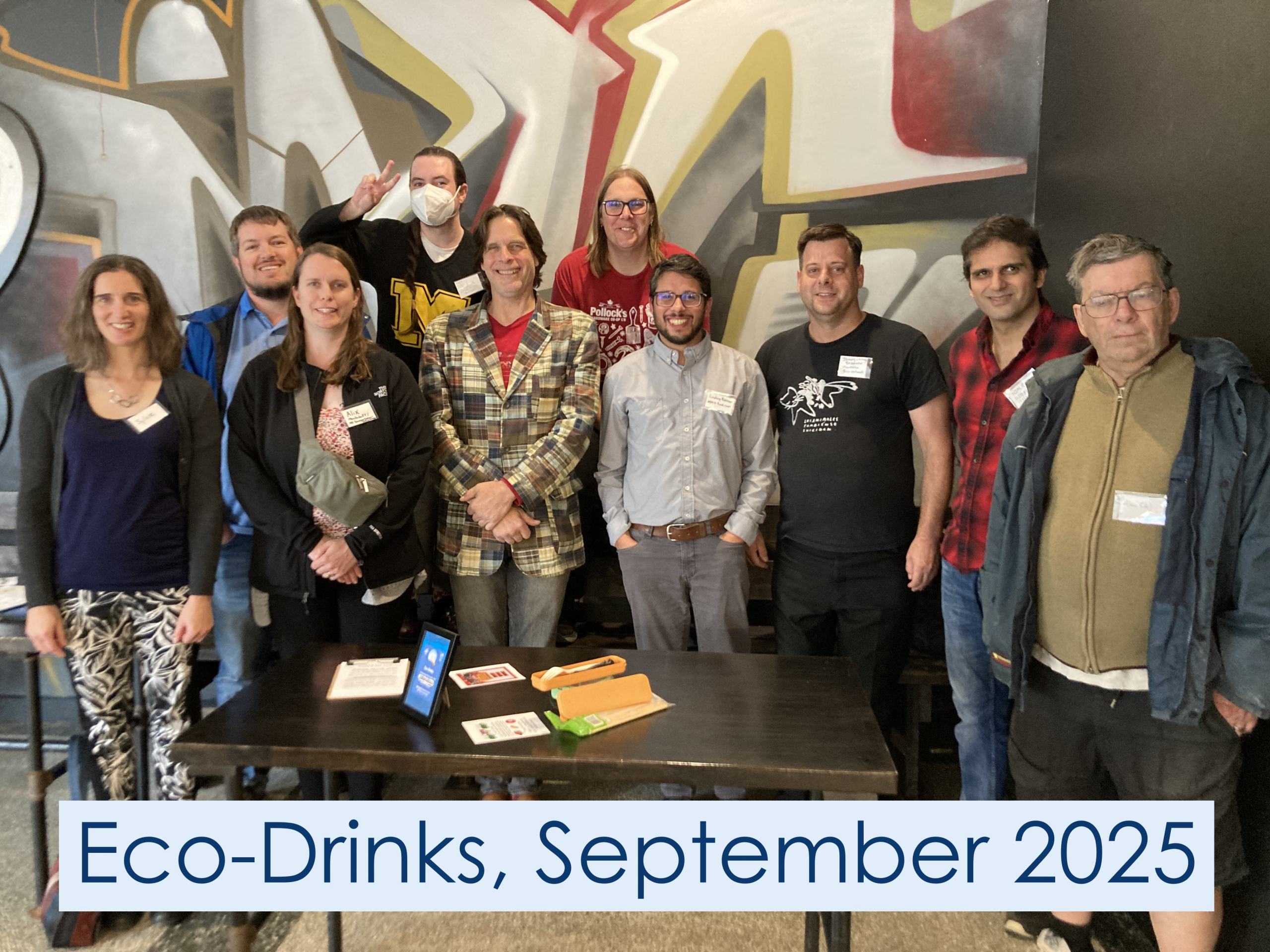Eco-Drinks, July 2025. They are holding a Saved Lemay sign in front of the group.