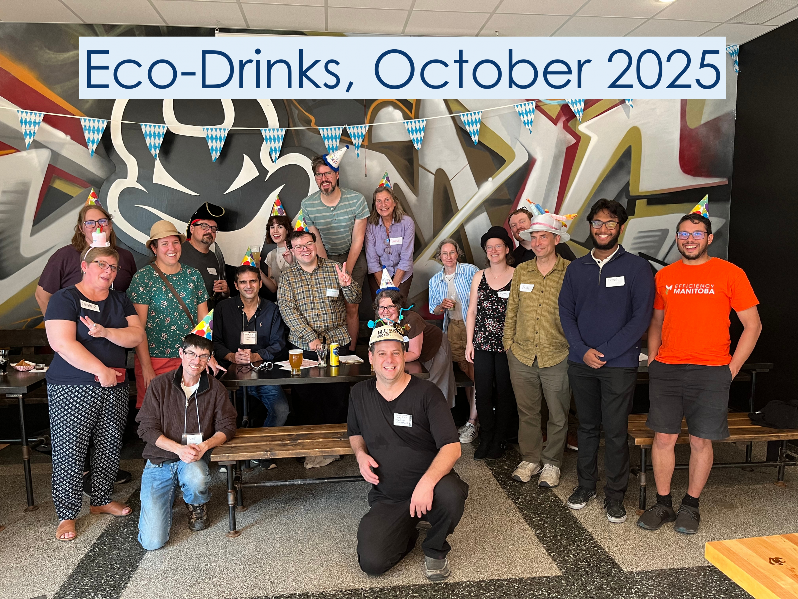 Eco-Drinks, July 2025. They are holding a Saved Lemay sign in front of the group.